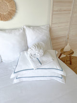 White Linen Sheet set with Pillow Shams and Light Blue Trim